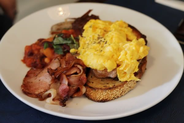 Big brekky Deli Breakfast – free range eggs on toast, bacon, Italian pork sausages & baked beans