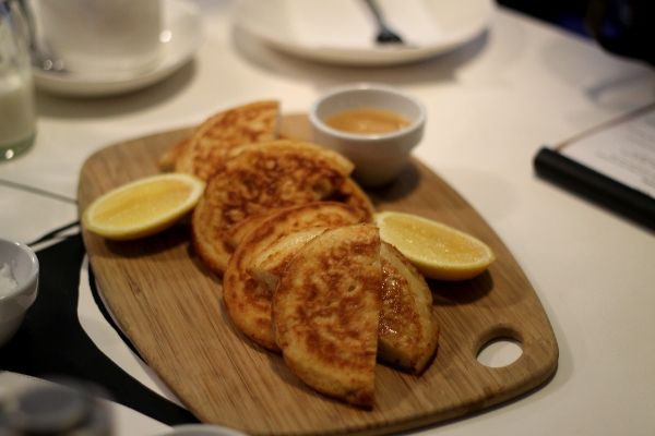 House made crumpets with lemon and creamy honey